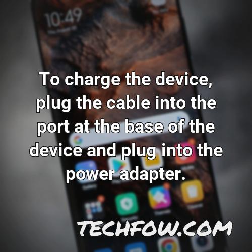to charge the device plug the cable into the port at the base of the device and plug into the power adapter