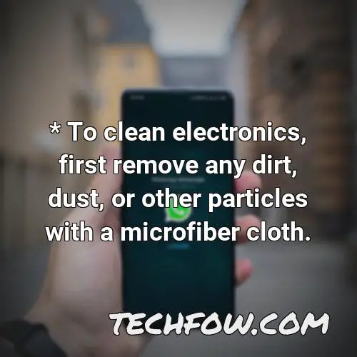 to clean electronics first remove any dirt dust or other particles with a microfiber cloth