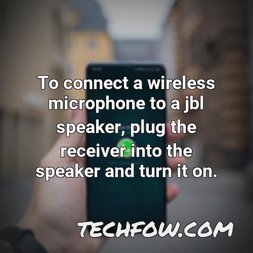 to connect a wireless microphone to a jbl speaker plug the receiver into the speaker and turn it on