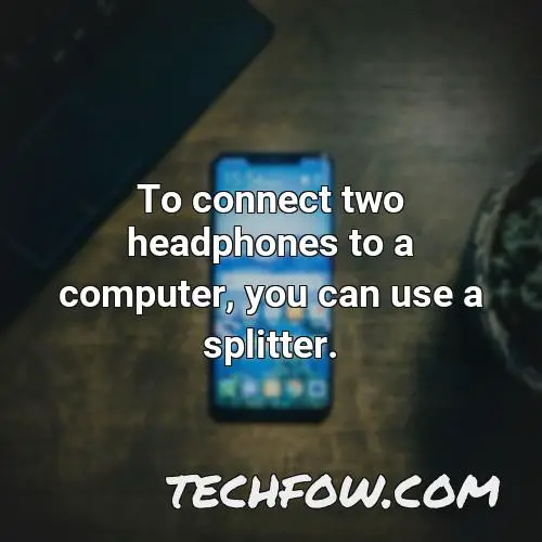 to connect two headphones to a computer you can use a splitter