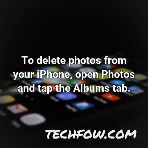 to delete photos from your iphone open photos and tap the albums tab