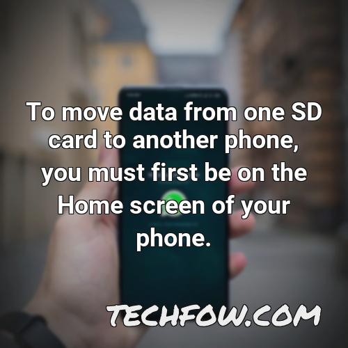 to move data from one sd card to another phone you must first be on the home screen of your phone
