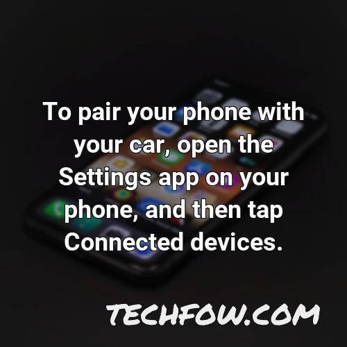 to pair your phone with your car open the settings app on your phone and then tap connected devices