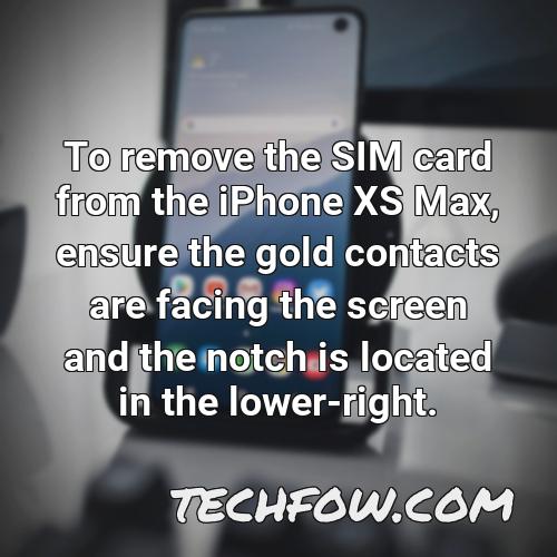 to remove the sim card from the iphone xs max ensure the gold contacts are facing the screen and the notch is located in the lower right