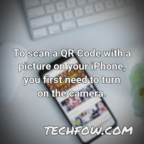 to scan a qr code with a picture on your iphone you first need to turn on the camera