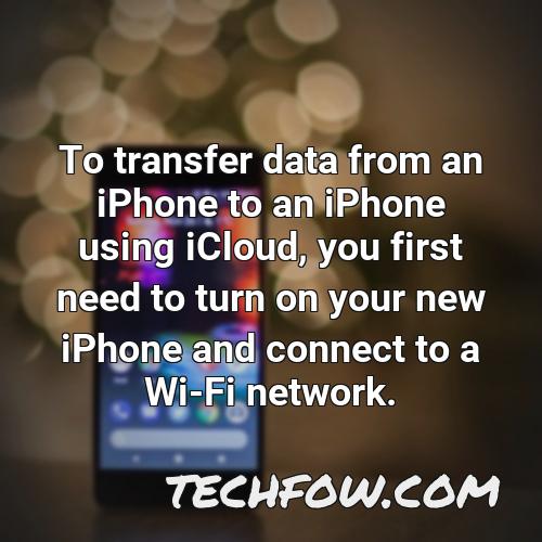 to transfer data from an iphone to an iphone using icloud you first need to turn on your new iphone and connect to a wi fi network