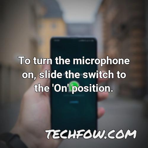 to turn the microphone on slide the switch to the on position