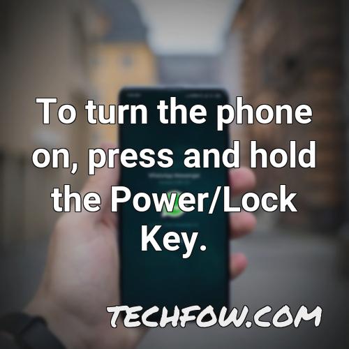 to turn the phone on press and hold the power lock key