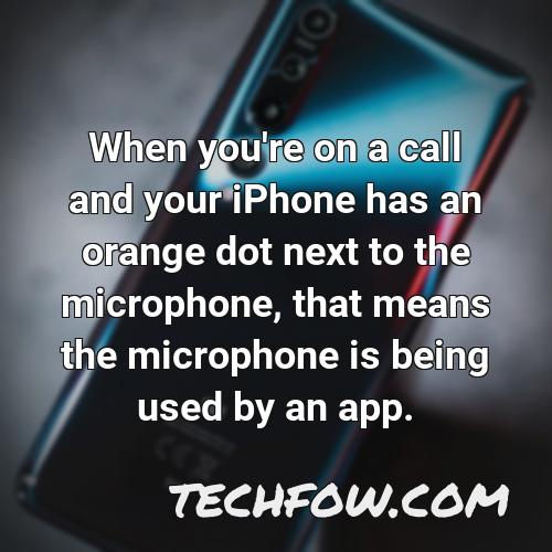 when you re on a call and your iphone has an orange dot next to the microphone that means the microphone is being used by an app