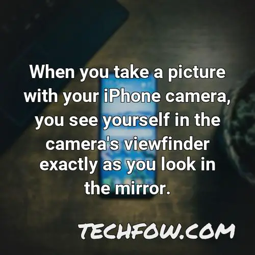 when you take a picture with your iphone camera you see yourself in the camera s viewfinder exactly as you look in the mirror