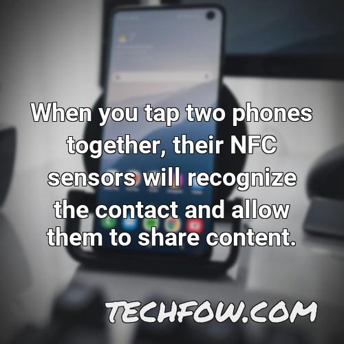 when you tap two phones together their nfc sensors will recognize the contact and allow them to share content