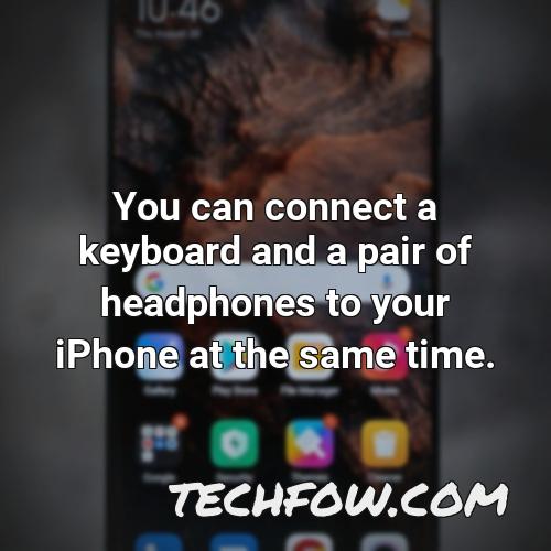 you can connect a keyboard and a pair of headphones to your iphone at the same time