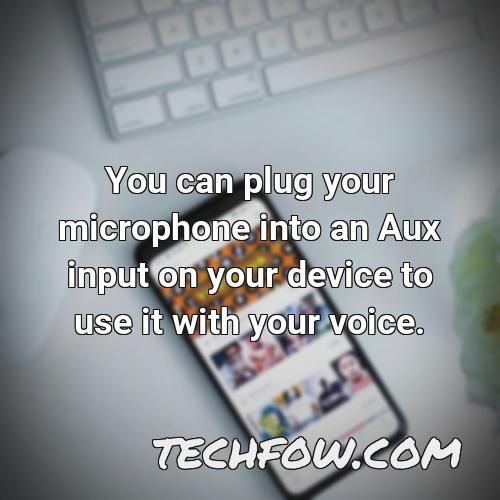 you can plug your microphone into an aux input on your device to use it with your voice