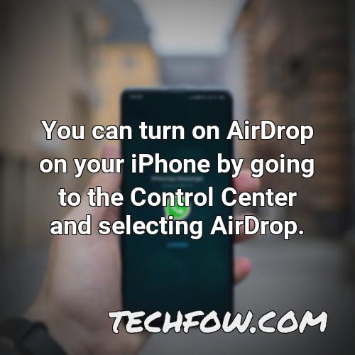 you can turn on airdrop on your iphone by going to the control center and selecting airdrop