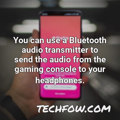 you can use a bluetooth audio transmitter to send the audio from the gaming console to your headphones