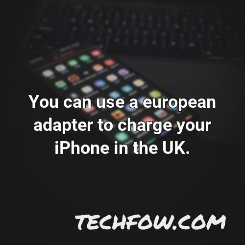 you can use a european adapter to charge your iphone in the uk