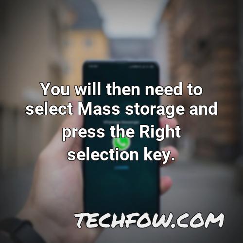 you will then need to select mass storage and press the right selection key