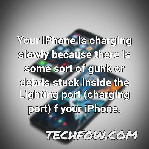 your iphone is charging slowly because there is some sort of gunk or debris stuck inside the lighting port charging port f your iphone