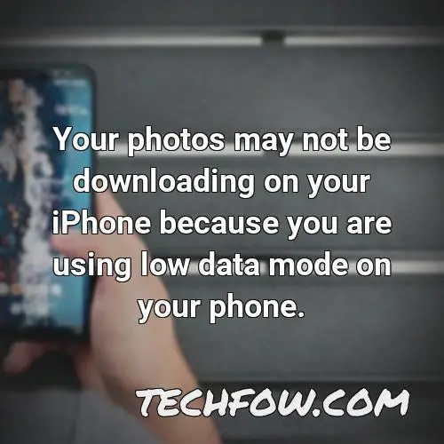 your photos may not be downloading on your iphone because you are using low data mode on your phone