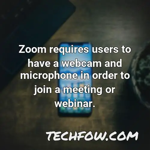 zoom requires users to have a webcam and microphone in order to join a meeting or webinar